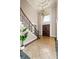 Elegant foyer with high ceilings, detailed staircase, and double front doors at 4002 Moheb Sw St, Atlanta, GA 30331