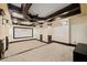 Basement home theater featuring coffered ceilings, sconces, and carpeted floors at 4002 Moheb Sw St, Atlanta, GA 30331