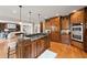 Large kitchen island with cooktop, breakfast bar and stainless appliances at 4002 Moheb Sw St, Atlanta, GA 30331