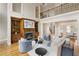 Open-concept living area showcasing fireplace with shelving and balcony at 4002 Moheb Sw St, Atlanta, GA 30331