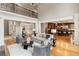 Open-concept living room connected to the kitchen, featuring hardwood floors and modern furnishings at 4002 Moheb Sw St, Atlanta, GA 30331