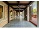 Outdoor living space featuring fireplace, stone columns, brick wall, and ceiling fans at 4002 Moheb Sw St, Atlanta, GA 30331