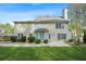 Exterior view of the home showcasing a patio and well-maintained backyard at 4522 Willow Oak Trl, Powder Springs, GA 30127