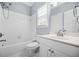 This bathroom has a shower and tub combination and a large vanity at 4522 Willow Oak Trl, Powder Springs, GA 30127