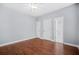 This bedroom has hardwood floors, a ceiling fan, and direct access to the bathroom at 4522 Willow Oak Trl, Powder Springs, GA 30127