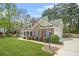 Well-maintained two-story home featuring a two car garage and landscaped front yard at 4522 Willow Oak Trl, Powder Springs, GA 30127