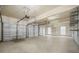 Spacious three-car garage with ample room for vehicles and storage at 4522 Willow Oak Trl, Powder Springs, GA 30127