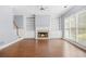 Living room with a fireplace, built-in shelves, and hardwood floors at 4522 Willow Oak Trl, Powder Springs, GA 30127
