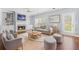 Cozy living room with fireplace, modern furnishings and lots of natural light at 4522 Willow Oak Trl, Powder Springs, GA 30127