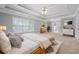 A well lit main bedroom with large windows and a large bed at 4522 Willow Oak Trl, Powder Springs, GA 30127
