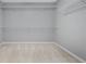 Walk-in closet with carpeted floors and shelving at 4522 Willow Oak Trl, Powder Springs, GA 30127