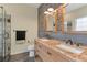Bathroom with double granite vanity, walk-in shower and decorative stone accent walls at 475 Brown Thrasher Ct, Alpharetta, GA 30009