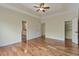 Spacious bedroom with hardwood floors and a tray ceiling at 475 Brown Thrasher Ct, Alpharetta, GA 30009