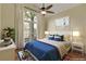 Bedroom with large windows, fan and sports decor at 475 Brown Thrasher Ct, Alpharetta, GA 30009