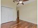Bright bedroom with hardwood floors and walk-in closet at 475 Brown Thrasher Ct, Alpharetta, GA 30009