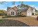 A well-maintained single-story home with a manicured lawn and a two-car garage at 475 Brown Thrasher Ct, Alpharetta, GA 30009