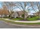 Attractive single-story home with meticulously landscaped yard, well-placed shrubbery, and trimmed trees at 475 Brown Thrasher Ct, Alpharetta, GA 30009