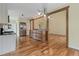 Modern kitchen with stainless steel appliances, granite countertops, and hardwood floors at 475 Brown Thrasher Ct, Alpharetta, GA 30009