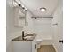 Well-lit bathroom featuring a vanity with a dark countertop and a shower and tub combination at 60 Riverside Pkwy, Sharpsburg, GA 30277