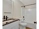 Bathroom featuring a granite vanity, black hardware, and a shower-tub combo at 60 Riverside Pkwy, Sharpsburg, GA 30277