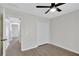 Neutral bedroom with trey ceiling, ceiling fan and access to a closet and a hallway at 60 Riverside Pkwy, Sharpsburg, GA 30277