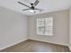 Bedroom featuring a ceiling fan and natural light from a bright window at 60 Riverside Pkwy, Sharpsburg, GA 30277