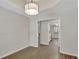 Inviting dining room has wood-look floors, neutral walls, and a modern light fixture at 60 Riverside Pkwy, Sharpsburg, GA 30277