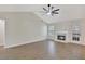 Spacious living room featuring vaulted ceilings, hardwood floors and fireplace at 60 Riverside Pkwy, Sharpsburg, GA 30277