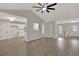 Open concept living area featuring hardwood flooring, a vaulted ceiling and seamless access to other spaces at 60 Riverside Pkwy, Sharpsburg, GA 30277
