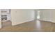 Open living room next to kitchen, features a bright patio door and wood-look flooring at 60 Riverside Pkwy, Sharpsburg, GA 30277