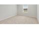 Neutral bedroom with plush carpet, natural light, and a serene, minimalist design at 7182 Brushwood Bend (Lot 114), Lithonia, GA 30058