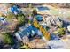 Breathtaking aerial view of an estate showcases a long driveway, mature trees, and proximity to the golf course at 2281 Bransley Pl, Duluth, GA 30097