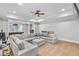 Open basement area with a comfortable sectional, tray ceiling, and ample space for recreation at 2281 Bransley Pl, Duluth, GA 30097