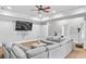 Spacious finished basement featuring a large sectional couch, recessed lighting, and a ceiling fan at 2281 Bransley Pl, Duluth, GA 30097