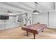 Basement with a pool table, entertainment area with a couch, and neutral-colored carpet at 2281 Bransley Pl, Duluth, GA 30097