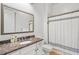 Cozy bathroom features marble countertop vanity and shower with curtain at 2281 Bransley Pl, Duluth, GA 30097