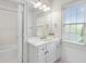Bathroom with white cabinets, white countertops, chrome hardware, and a shower-tub combo at 2281 Bransley Pl, Duluth, GA 30097