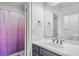 Bathroom with a dark blue vanity, a white countertop, and a shower with a pink curtain at 2281 Bransley Pl, Duluth, GA 30097