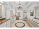 Luxurious bathroom with double vanity, soaking tub, walk-in shower, and chandelier at 2281 Bransley Pl, Duluth, GA 30097