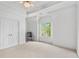Bright bedroom with white walls, a ceiling fan, and a window with natural light at 2281 Bransley Pl, Duluth, GA 30097