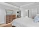 Calm bedroom featuring neutral colors, a large bed, a dresser and access to other rooms at 2281 Bransley Pl, Duluth, GA 30097