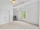 Spacious bedroom with white trim, neutral walls, a fan, and carpet at 2281 Bransley Pl, Duluth, GA 30097