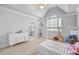 Bright bedroom with a modern bed, a white dresser, and neutral walls and carpet at 2281 Bransley Pl, Duluth, GA 30097