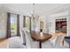 Formal dining room with natural lighting, wallpaper, hardwood floors, and comfortable seating at 2281 Bransley Pl, Duluth, GA 30097