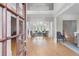 Grand foyer with hardwood floors, decorative columns, and an open view to the living room at 2281 Bransley Pl, Duluth, GA 30097