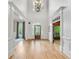Bright foyer with hardwood floors, high ceilings, and decorative trim at 2281 Bransley Pl, Duluth, GA 30097