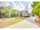 Beautiful brick home with a well-manicured lawn and long driveway, showcasing curb appeal at 2281 Bransley Pl, Duluth, GA 30097