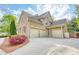 Spacious three-car garage with a long driveway and well-maintained landscaping at 2281 Bransley Pl, Duluth, GA 30097