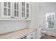 Hallway featuring custom cabinets, granite counter, and access to a half bath at 2281 Bransley Pl, Duluth, GA 30097