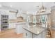 Modern kitchen featuring an island, stainless steel appliances, and granite countertops at 2281 Bransley Pl, Duluth, GA 30097